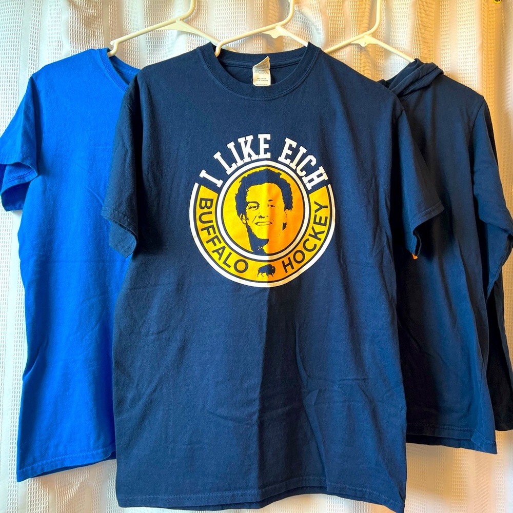 Lot of Jack Eichel branded shirts.